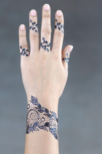 small tattoo design on wrist with crisp lines and simple shading