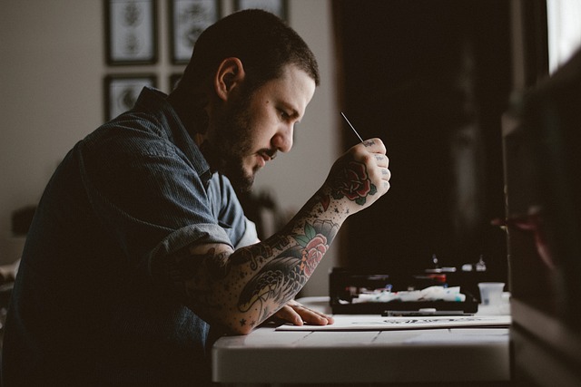 tattoo artist preparing stencil and clean workstation in Toronto studio